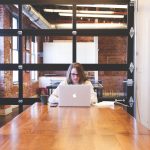 Student, typing, keyboard — 5 reasons why you should work under an umbrella firm