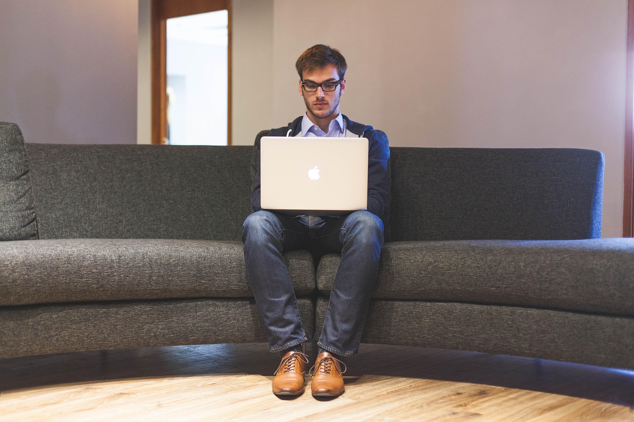 Man, laptop, businessman — A few benefits of using a digital business card