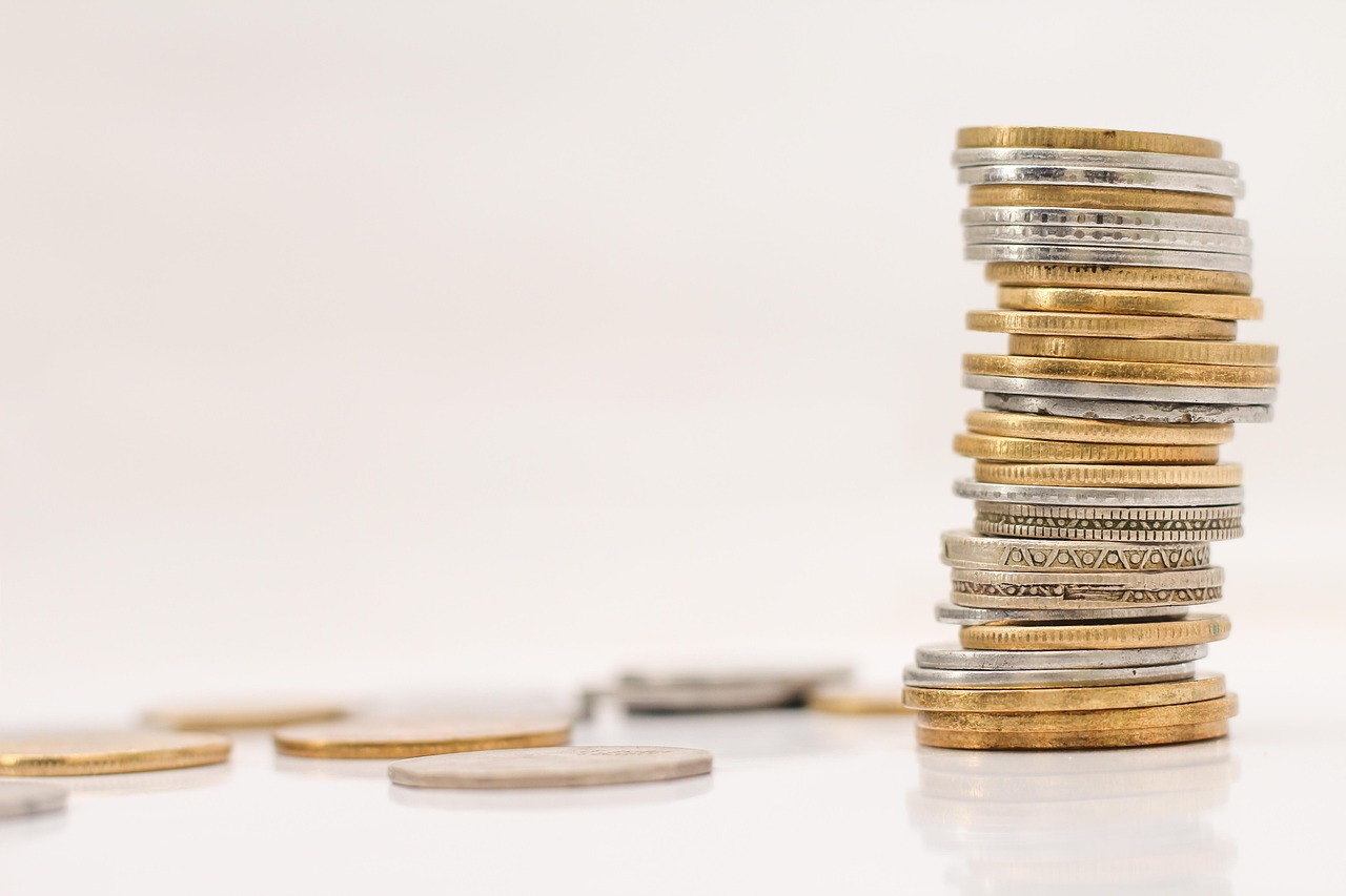 Coins, money, stacked — Choosing The Best Stock Market Trading App For Instant Investment