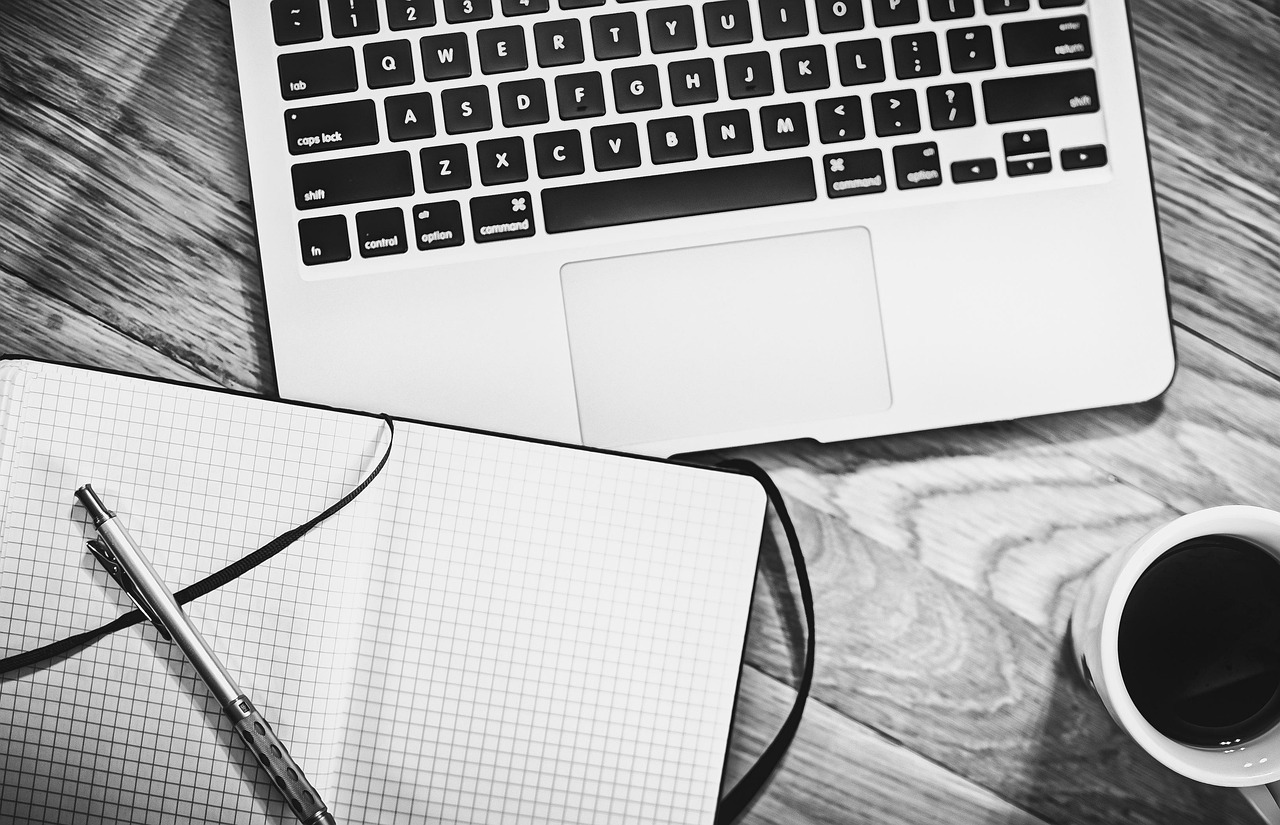 Computer, notebook, coffee — Hire A Microsoft Access Expert to Train Your Staff