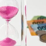 Hourglass, money, time — How to Drastically Reduce Your Family Debts and Expenses