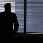 Businessman, silhouette, windows — How to Prepare for Moving Your Items During Winter