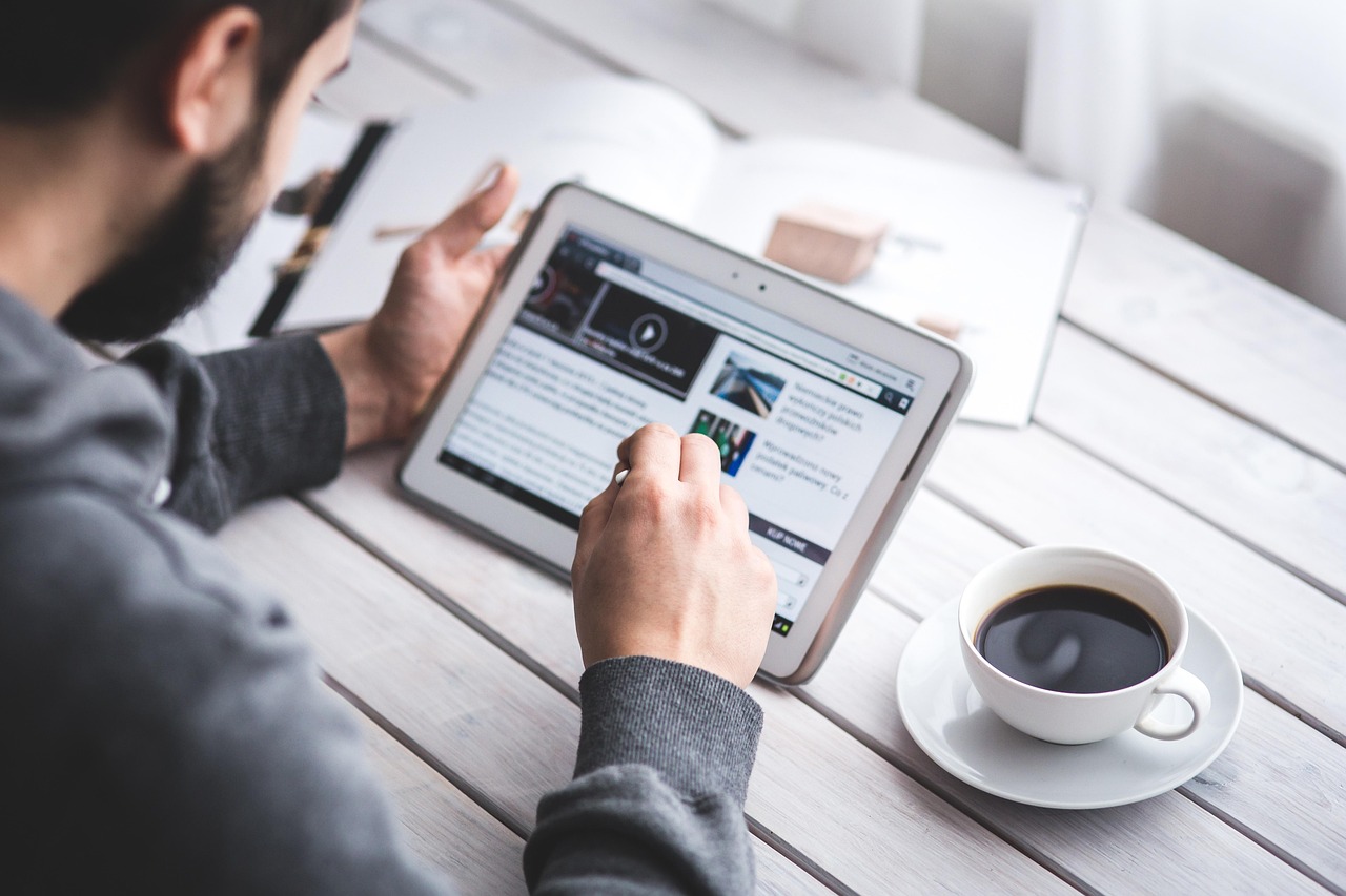 Man, reading, touchscreen — Karaoke Hosting Jobs: Fun, Flexible, and Perfect for Part-Time