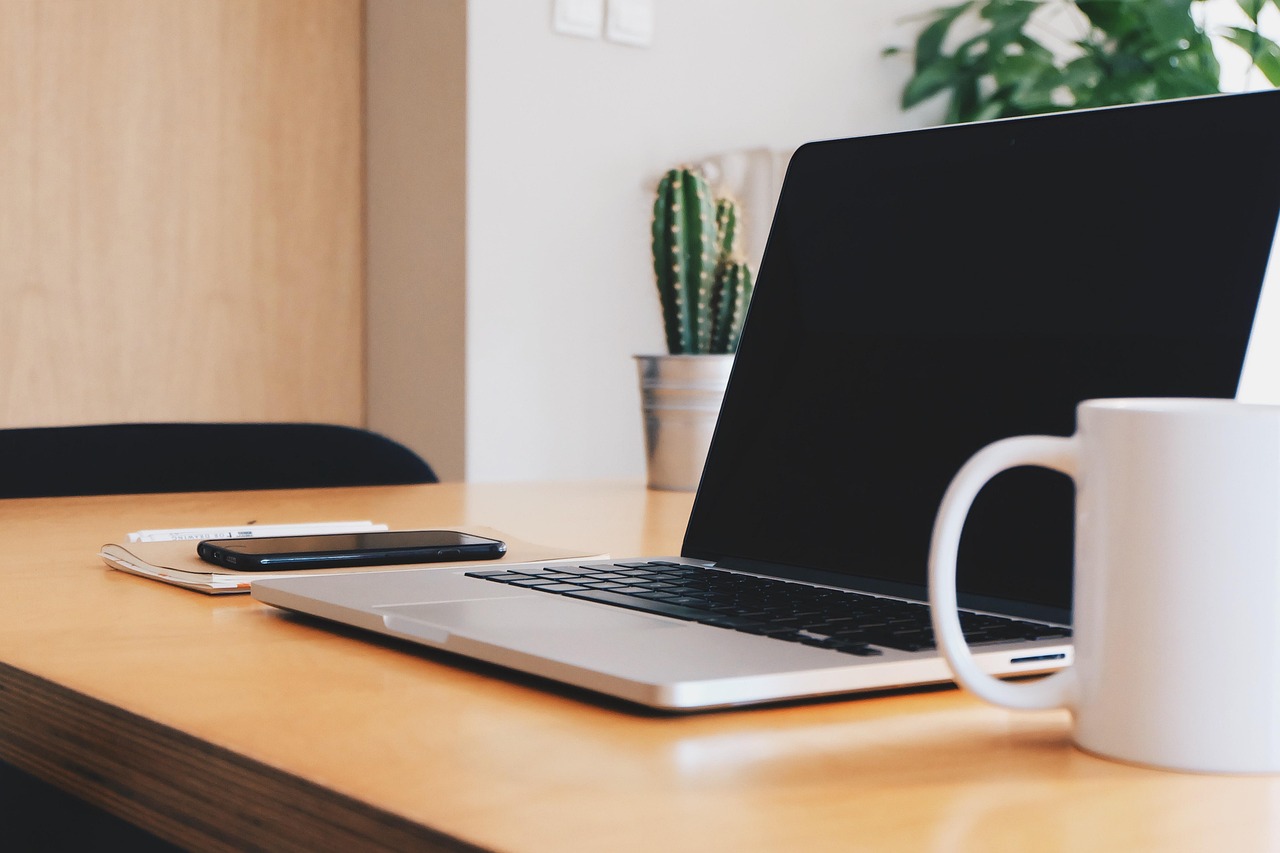 Office, desk, coffee cup — Make money from music: Best Possible Practices for Spotify Promotion