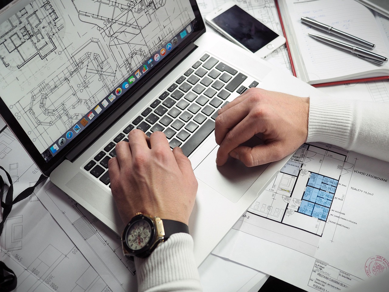 Blueprints, entrepreneur, hands — Online Printing Made Simple for Small Businesses