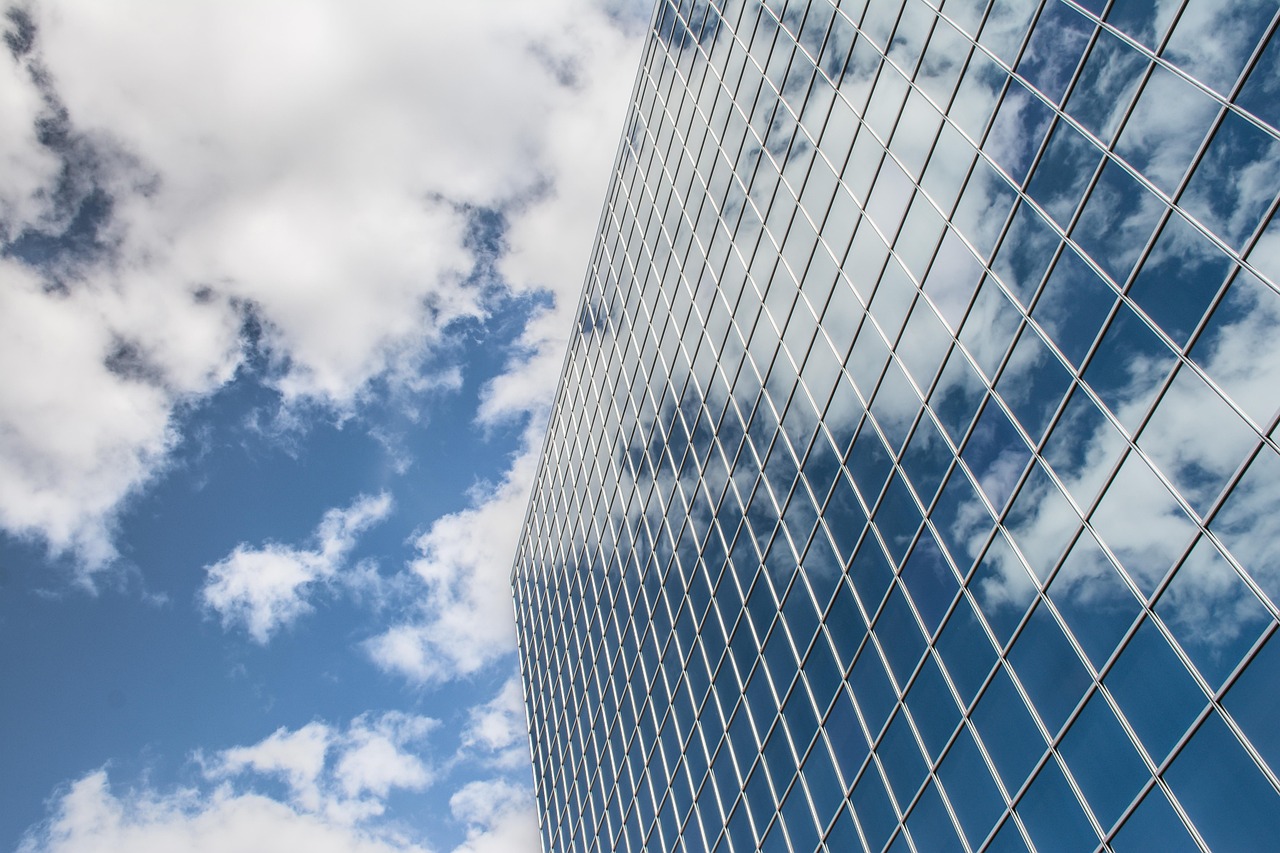 Building, reflection, clouds — Professionals From India: Add International Working Experience To Your Portfolio with a Hong K