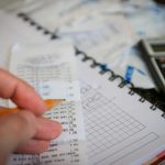Money, bills, calculator — Shopping At a Furniture Thrift Store